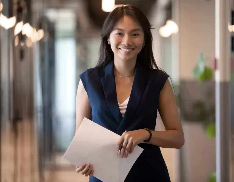 Human Resources HR Manager Smiling with Notes for Meeting